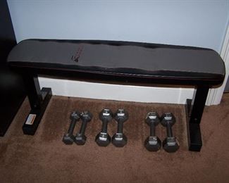 Weight bench and 3 sets of dumbbells