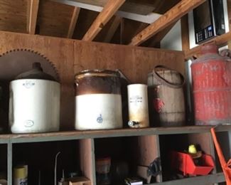 Antique Crocks sitting on a double stacked wooden nail bin from the Lumber Store