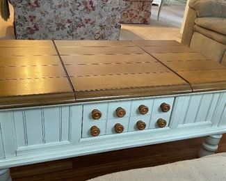 Great wood coffee table both ends open for storage