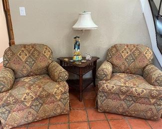 Pair of swivel club chairs.