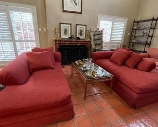 Pair of red upholstered loungers. Totally nap ready!