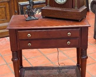 Side table with lower caned shelf.