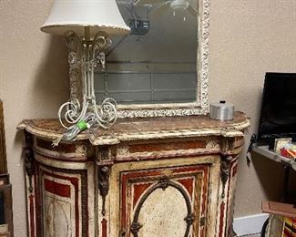 Antique French style console cabinet. Painted finish with gilt ormolu. Needs some TLC but she’s a lovely old gal!
