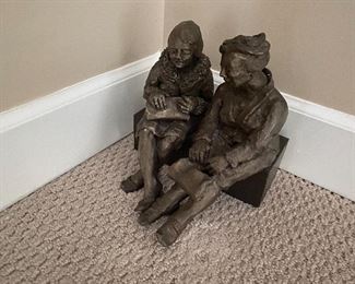 Two women on a bench sculpture 