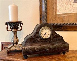 74.	Battery operated clock and candlestick 	$26