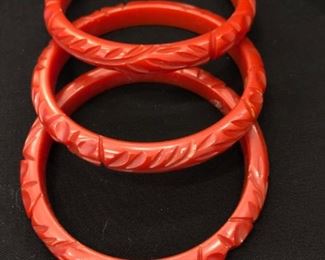 group of 3 cinnabar/ paprika colored carved bakelite barcelets