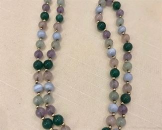 multi colored jade necklace with 14 kt gold spacers and clasp