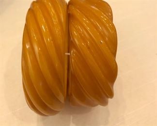 pair of ribbed pumpkin colored bakelite bracelets