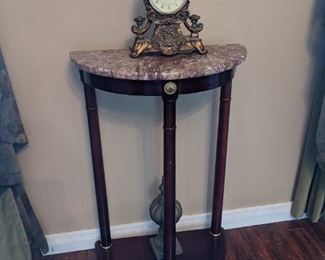 Demilune marble topped table