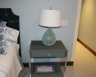 Pair of pale green side tables: wood and lucite. $650 each. Pair of green glass lamps: $250 each