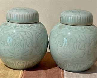 Item 385:  (2) Celadon Covered Jars - 4.25" - please note condition issue on one of the lids:  $42