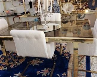 Dining Room Table has built in Extension leaf and lets out to seat 6 to 8. The table is shown with 4 matching chairs but comes with 6.