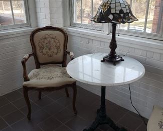 Marble top iron base table and one of a pair of French open armchairs