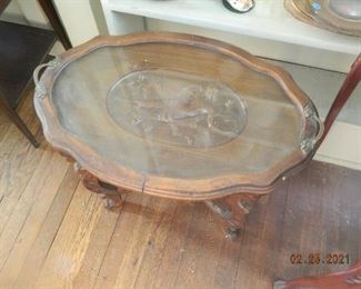antique table with glass tray