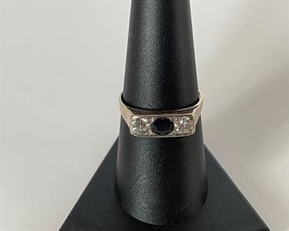 Sapphire and diamond ring - size 8 1/4 - two stones on the edge are diamonds and middle stone is sapphire - sapphire has some small surface  chips but stone overall in good shape -price 400 dollars