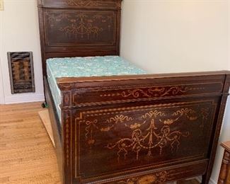 	#21	Antique twin bed from mid 1800s on casters with a Restonic mattress and box spring set. As is-one broken caster.	 $125.00 		