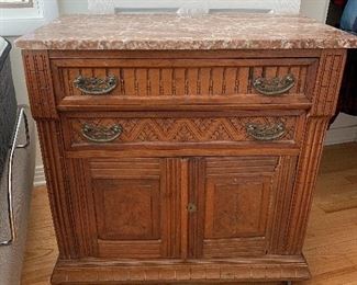 	#25	Marble top antique chest with 2 drawers and 2 doors on casters 31"x18"x32"	 $125.00 		