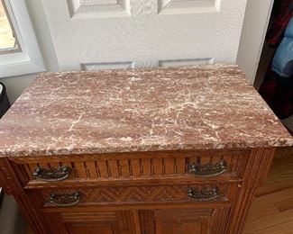 	#25	Marble top antique chest with 2 drawers and 2 doors on casters 31"x18"x32"	 $125.00 		