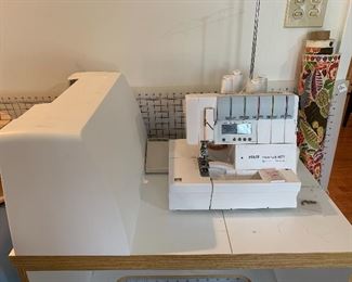 	#33	PFAFF Coverlock 4872 serger with sewing cabinet on wheels	 $200.00 		