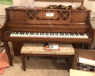 Awesome upright piano in great shape includes the piano bench and several pieces of music
