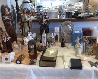 This whole table is covered in religious statues, crosses, rosaries and lots of beautiful items