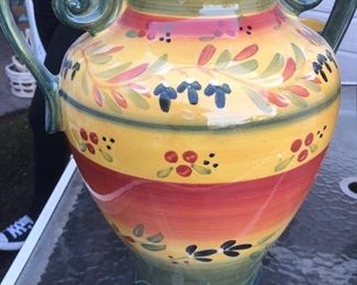 Coordinating hand-painted vases, there are three of these