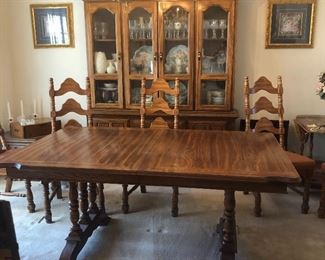 Gorgeous dining room table, comes with one leaf, table pads and eight chairs. The table has been under its table pads for its lifetime so the top of the table is in perfect condition. Also the China cabinet that coordinates with it is for sale.