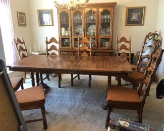 Dining room table with eight chairs and coordinating China cabinet