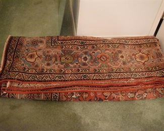 Antique Persian carpet that is over 17' long.