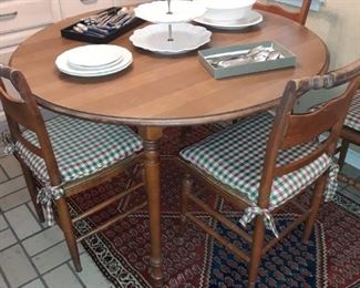 Tell City Furniture round dining table with two leaves and 6 rush seat chairs
