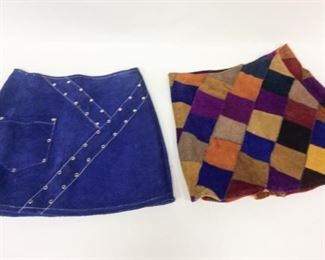 Lot	52	Vintage Suede Skirts - Solid Purple & Multi Color	Pair of Vintage Suede Skirts - Solid Purple - Pocket Front - Silver Studding Design - Size Medium Mulit Colored Diamond Patterned - Size Large both are zipper back closure
