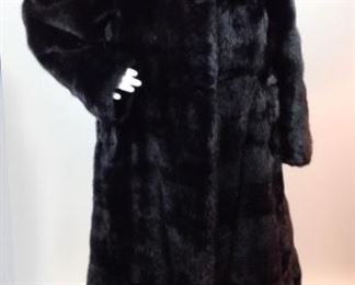 Lot	66	Full Length Mink Fur Coat	Full Length Black Mink Fur Coat Satin Lined - Crochet Collar Button Closure No Sizing or Maker Label - maybe custom - similar to a woman's size 8) Shoulder to arm 25" Length 55"
