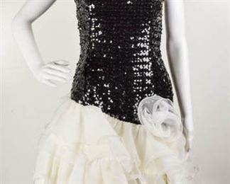 Lot	79	Strictly Swift Cocktail / Party Sequin Dress	Strictly Swift Cocktail / Party Black Sequin Dress Skirt Portion is Layers of Organza with Large Organza Flower Size Medium - 100% Polyester
