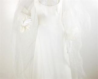 Lot	80	Vintage Wedding Dress Elizabethan Design & Veil	Vintage circa 1980's Wedding Dress Elizabethan Era Inspired Design Lace Sleeves - Braided Crown attached polka dotted Veil No Sizing Tag - similar to a woman's size 8 Condition - Some staining on front - see pictures, has not been cleaned.
