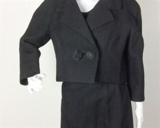 Lot	87	Vintage Balenciaga Paris - 3 pc. Black Suit	Vintage Balenciaga - 10 Avenue George V. Paris 3 Piece BLACK Suit = Jacket /Sleeve-less Top/Skirt  back zipper with closure 3 hook Top side zipper closure Jacket is short with Two 3-D Flower Buttons on front **** NO SIZING ***** Approximately Skirt measure 25 " waist with length 26" Approximately Top measures across bust 18" Approximately Jacket shoulder to shoulder 22" Front button is loose
