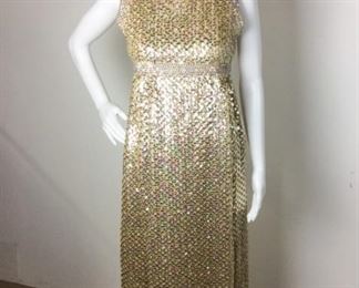 Lot	92	Vintage Sutton Place Gold Sequin Gown	Vintage - SUTTON PLACE Bloomingdale's New York Traffic Stopping, Fabulous Full Length Gown Gold Sequin and Rhinestone Sleeveless Gown - Zipper on Back *** NO SIZING *** Measures Approx. 27" around the waist / top to bottom 54 " in length
