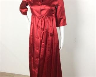 Lot	93	Vintage Dynasty Red Coat Dress /Gown	Vintage Dynasty made for Lord & Taylor New York in the British Crown Colony - Hong Kong Oriental Fashioned Red Satin 3/4 length Sleeve Coat Dress /Gown Lucky 7 Knotted Buttons down the Front Size 10
