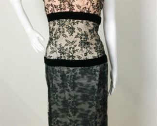 Lot	98	Vintage Fontana Italy Lace & Velvet Dress	Vintage Fontana - Italy Black Lace over Peach & Gray Satin with Velvet Trim Accents Single Shoulder Straps - Zipper Back No Sizing Labels - Measures approximately 29" around waist Straps are not attached but pinned on.
