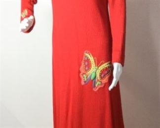 Lot	102	Vintage Knit Red Butterfly Long Dress	Vintage One of a Kind Knit Red Long Sleeve - Long Dress with Two Hand Sewn Multi Colored / multi Thread Butterflies and One small Butterfly on right sleeve / cuff Tie Neck Line Back Closure - Zipper Back No Size Label measurements similar to a women's 6 ) Condition - garment has small age holes along hem line.
