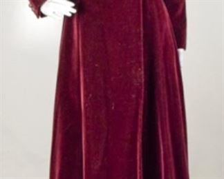Lot	107	Custom Creation Merlot Velvet Opera Coat	Custom Creation Dramati Merlot Velvet Opera Coat Two Ruby Jeweled buttons on each Cuff Satin matching belt **** NO SIZING **** Measures Approx. 30" around waist - 43" bodice to bottom long Belt measures "36
