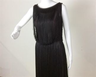 Lot	111	Vintage 1920 String "Flapper-Like" Black Dress	Roaring 20's style String "Flapper-Like" Black Dress Stringing over Sleeve-Less Polyester Dress Body ****NO MARKER _ NO SIZING **** ( educated guess women's 8 )
