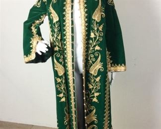 Lot	110	Vintage Custom Creation Ornate Green Velvet Jacket	Vintage Custom Creation Ornate Green Velvet Jacket Adorned in Golden Threading - 21 Knotted Buttons in Front Green Silk Lining - LOOK @ Embroidery Detailing Amazing 3 Button Cuffs - Side Buttons Lower Portion **** NO SIZE ***** STUNNING NEEDLE WORK !!! Measures Approx. Women's 8
