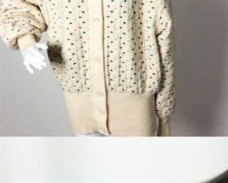 Lot	122	Ungaro COMBO Sweater / Belt	Ungaro solo donna Paris / Bergdorf Goodman NY Sweater SIZE 44 - cream sweater ticked hunter green, mango, burgundy second item Belt - black suede metal bar embellishments measures approx. 34" **** dark mark under left side under arm ****
