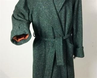 Lot	149	Yves Saint Laurent Rive Gauche Wool Wrap Coat	Yves Saint Laurent Rive Gauche Green Ticked Wool Belted Wrap Coat Silk Copper Colored Lining Size 36 - Made in France - Small  stain - inside coat - lining lower portion back side
