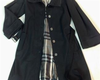 Lot	157	Burberry London - Classic Black Belted Raincoat	Burberry London - Timeless Classic Black Belted Raincoat Black & White Nova Liner SIZE 10 Marks around the collar
