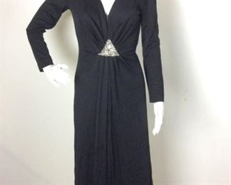 Lot	162	Vintage Romantica by Victor Costa Gown	Vintage Romantica by Victor Costa Long Sleeve Black Gown Rhinestone and Jewels Triangle Design on front Open / Kep Hole Back - Zipper Back / Neck Snap Fastener SIZE 10
