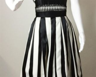 Lot	163	Victor Costa Black & White Party Dress	Victor Costa Black & White Stripped Party Dress Tulle under Skirt Boning in Bodice - Strapless - Lace Hem& Bodice Accents (stain spots on back side skirt portion ) SIZE 8
