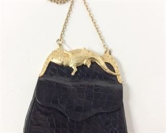 Lot	165	Ann Turk Black Golden Alligator Purse	Glen Miller for Ann Turk Black Cross Body Purse gold hardware frame adorned with Alligator chain strap
