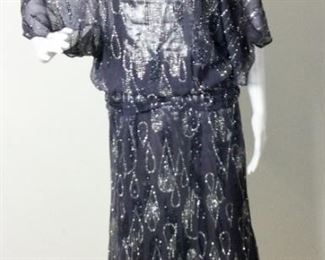 Lot	195	Vintage Silver Lame Purple Sparkle Dress	Silver Lame Sheer Purple Over-Lay Tear-Drop Design Silver & Purple Glitter Make this Dress Sparkle Gathered Waist Line - Ready for any Party ***** NO SIZING **** ( measures approx. women's 8 )
