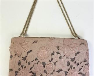 Lot	203	Valentino Garavani Lambskin Lace Pink Blush Purse	Authentic Authentic Valentino Garavani Lambskin Lace Pink Blush Girello Flap Large Purse. This chic evening bag is beautifully crafted of intricate lambskin lace. This shoulder bag features gold chain shoulder straps and a frontal flap with a studded twist lock. The flap opens to a multi-compartment mesh interior spacious enough for day or evening essentials with the classic style only from Valentino Garavani! Length: 12.5 in Width: 2 in Height: 9 in Drop: 12 in Designer ID#: BS-E429NAQ1 Condition: Appears barely used
